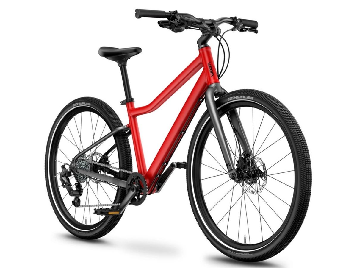 Woom Explore 5 har 8 gir, skivebremser og terrengdekk. Robust sykkel for barn 7–11 år (125–145 cm).