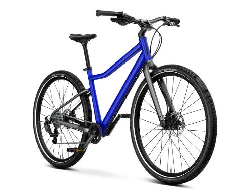 Woom Explore 6 har 8 gir, skivebremser og terrengdekk. Robust sykkel for barn 10–14 år (140–165 cm).