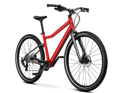 Woom Explore 6 har 8 gir, skivebremser og terrengdekk. Robust sykkel for barn 10–14 år (140–165 cm).