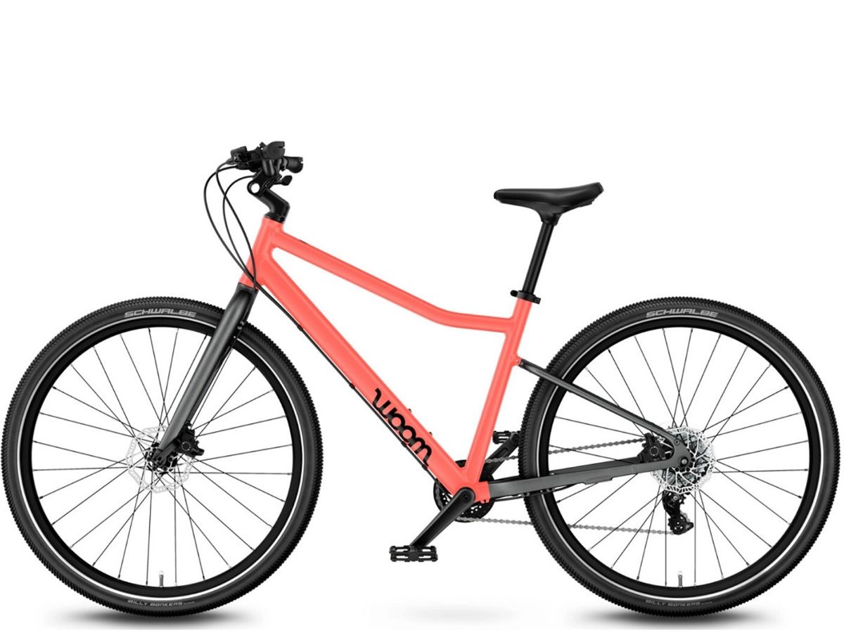 Woom Explore 6 har 8 gir, skivebremser og terrengdekk. Robust sykkel for barn 10–14 år (140–165 cm).