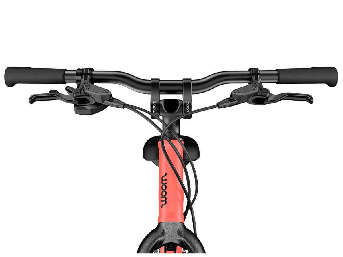 Woom Explore 6 har 8 gir, skivebremser og terrengdekk. Robust sykkel for barn 10–14 år (140–165 cm).